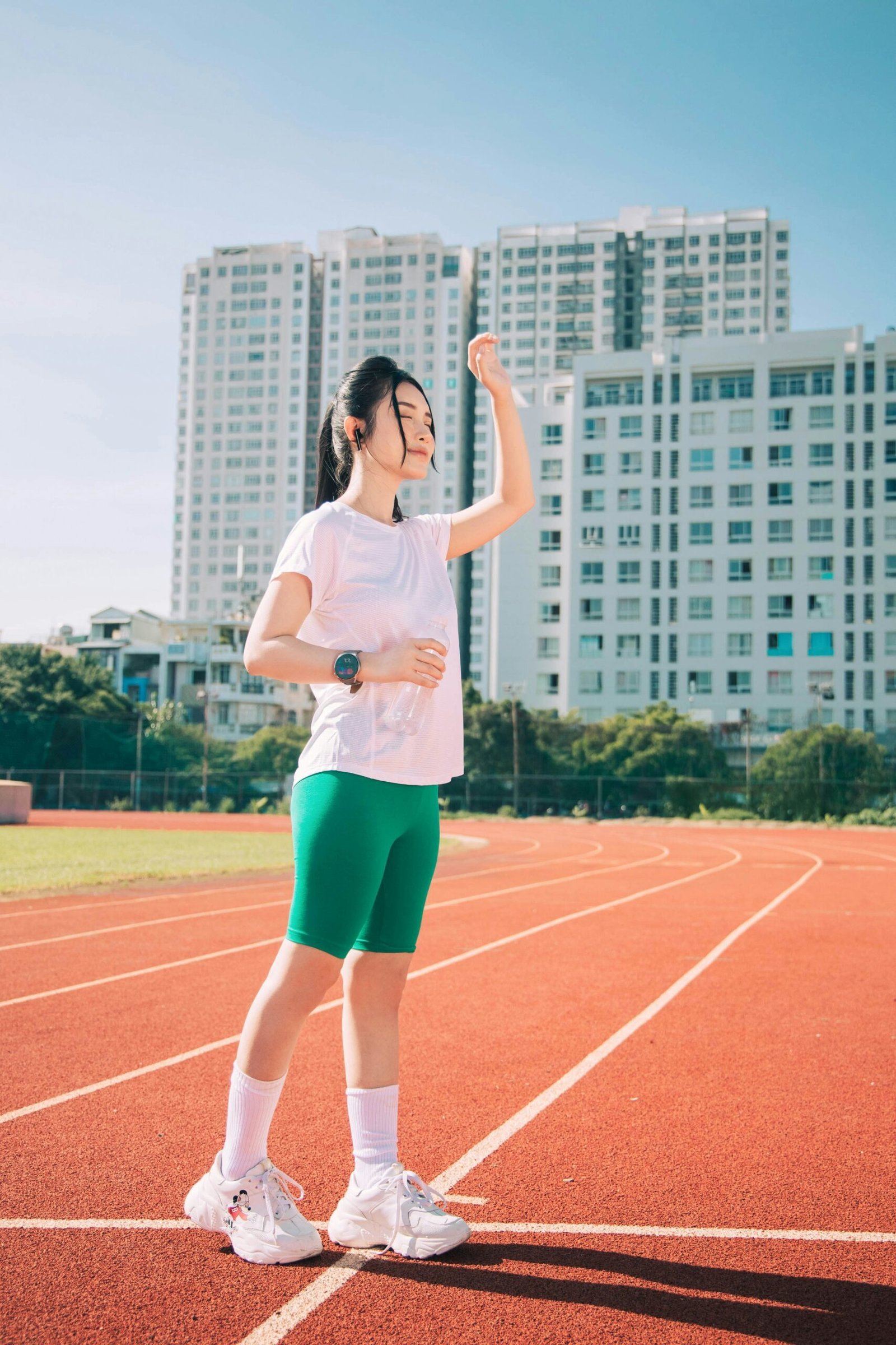 a woman standing on a track